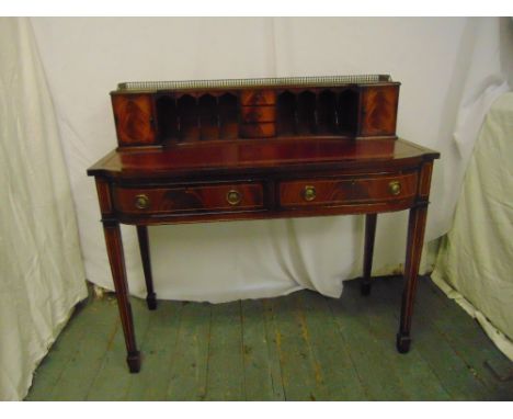 A Carlton House mahogany desk, two drawers on tapering legs with spade feet