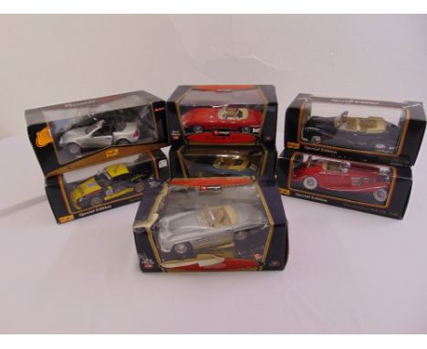 Seven 1/18 scale diecast model cars to include Hotwheels and Maisto