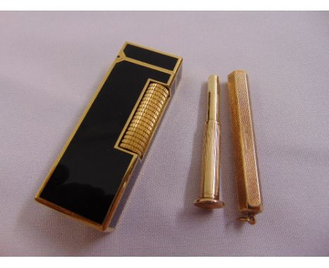 Dunhill gold plated and black enamel cigarette lighter and a 9ct yellow gold cigar piercer