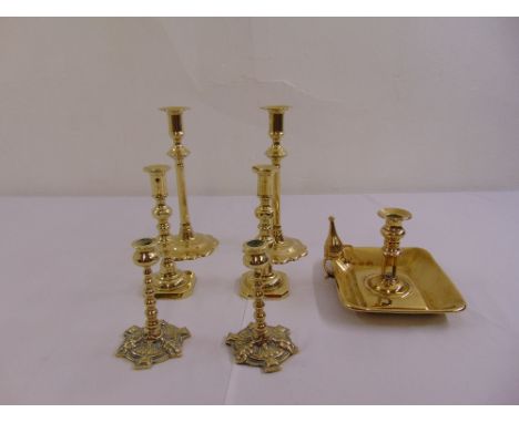 Three pairs of brass candlesticks and a chamber stick with accompanying snuffers