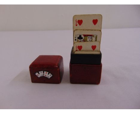 A cased set of Victorian miniature playing cards, the red leather case with applied enamel card decoration