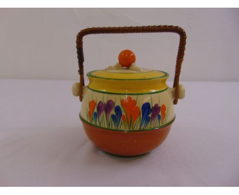 A Clarice Cliff Crocus biscuit barrel with wicker handle, A/F