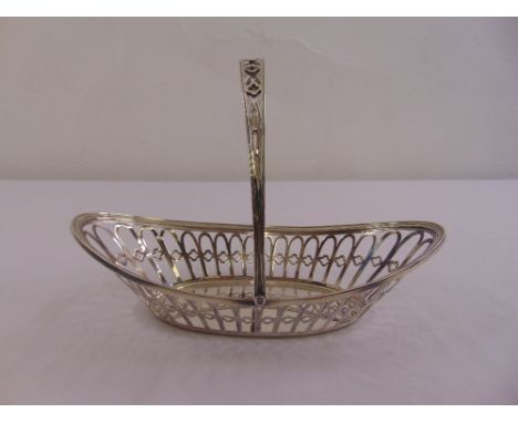 A silver oval pierced roll basket with pierced swing handle, Sheffield 1906 by James Dixon and sons