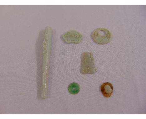 A quantity of jade to include plaques and an opium pipe (6)