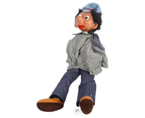 A Vintage Pelham ventriloquist puppet, possibly 60s/70s, puppet length 70cmThe ventriloquist mouth action is in good working 