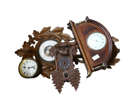 An Edwardian mahogany and satinwood-strung dome-top mantel clock, with brass columns (not working), a walnut-framed barometer