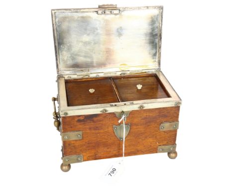 A Victorian oak tea caddy with engraved silver plated mounts and handles, resting on ball feet, L21cm 