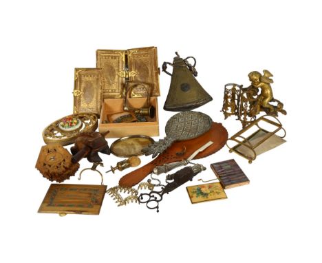 A collection of various gilt-metal stands, leather and brass-mounted book covers, cherub finial, powder flask etc (boxful) 