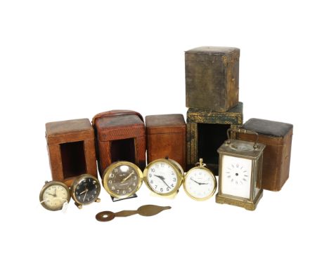 A group of Victorian and early 20th century leather carriage clock travelling cases, a brass carriage clock, A/F, various oth
