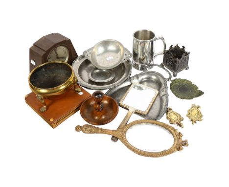 A silver hand mirror, 24.5cm, another, a brass pot on lion paw feet, a Bakelite Ingersoll mantel clock, a pot, pewter items e