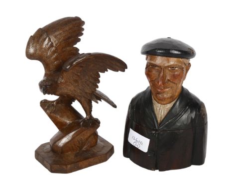 A Black Forest carved eagle on stand, H13cm, and a Tyrolean carved and painted inkwell in the form of a man in a beret (2) 