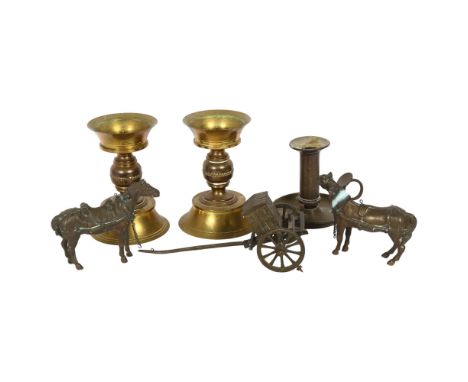 A pair of turned brass candlesticks, a brass chamber stick, and 2 brass horses and carriage (5) 