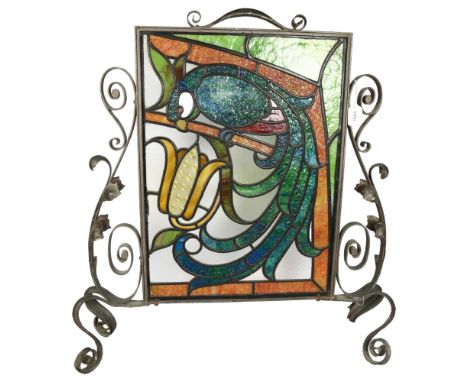 An ornate wrought-metal framed stained glass leadlight fire screen, with parrot and flower design, H79cm 