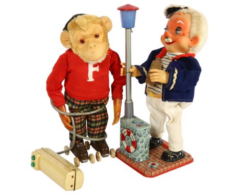 A Vintage battery-operated remote control monkey on roller skates, by "Reborn", and a Roscoe battery-operated tinplate drunke