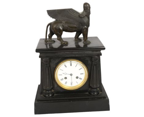 An Egyptian Revival black slate mantel clock, 8-day bell striking movement, white enamel dial, surmounted by lamassu, H39cmA 