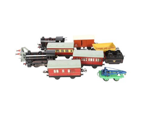 HORNBY - a group of O gauge Hornby clockwork locomotives, coaches, goods wagons and other boxed items, including a Hornby Tra