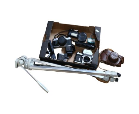 A quantity of Vintage cameras and equipment, including a Canon AV-1, with associated lens (FD50MM1..1.8). A Vintage lightweig