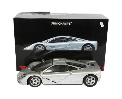 MINICHAMPS - a boxed 1:12 scale 1994 McLaren F1 Roadcar model by Minichamps, in original boxBox - there is a slight tear on t