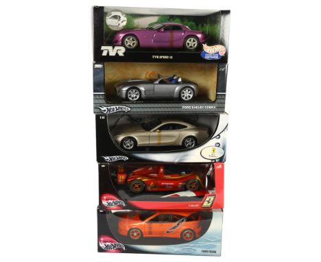 HOT WHEELS - a quantity of 1:18 scale diecast vehicles, complete in original boxes on associated display stands, including a 