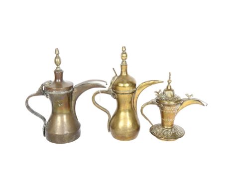 A Vintage Dallah engraved Eastern brass coffee pot with applied birds, H22cm, and 2 similar larger coffee pots 