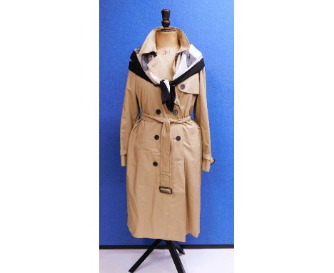 A beige Aquascutum trench coat, double breasted with belted waist, size 12 together with an Aquascutum silk scarf (2)