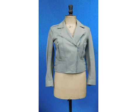 A lady's leather biker jacket by Belstaff, the beige leather jacket with front zip pockets, double buckle detail to sides, sh