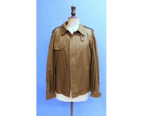 A gentlemans green Burberry bomber jacket, the short green jacket with zip front, side pockets, buckle detail to side hem, bu