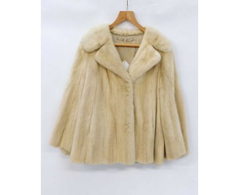A lady's 'pearl' mink jacket, with single clip fastening and side pocketsvery slightly stiff some staining to liningoriginal 