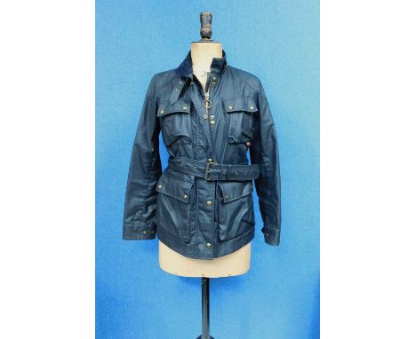 A lady's Belstaff Trailmaster Professional jacket, the navy blue  zip front with corduroy collar, breast and front patch pock