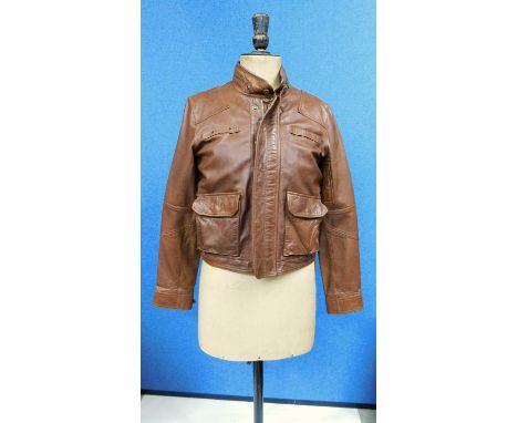 A lady's Ralph Lauren Polo tan leather jacket, zip fronted with front patch pockets, zip detail to collar, small zip sleeve p