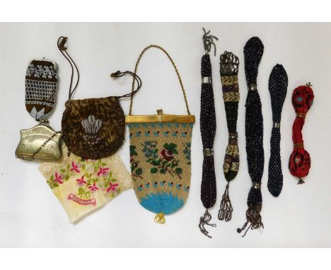 A quantity of beaded and misers purses, to include five beaded misers purses, a brown velvet and fleur de lys beaded purse, a
