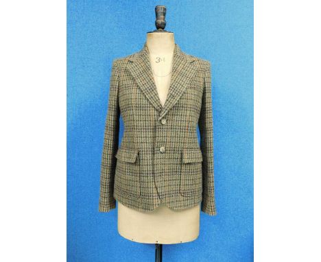 A lady's Ralph Lauren brown tweed jacket, single breasted with two button fastening, front patch pockets, buttons to cuffs, s