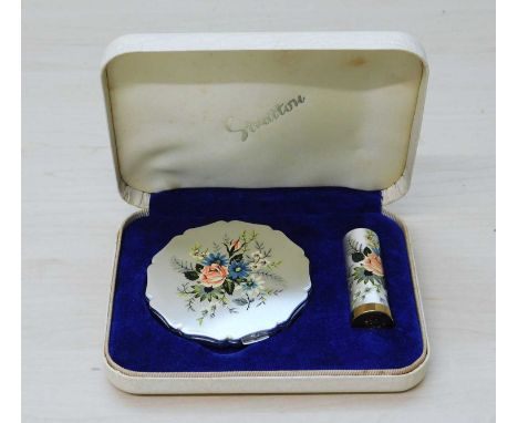 A cased Stratton compact and lipstick, both with satin finish decorated with flowers, in presentation case