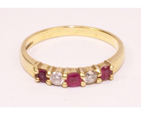 18ct five stone diamond and ruby ring hallmarked. Size M-N. Approx 2.6gm.     Condition Report   Click here for further image