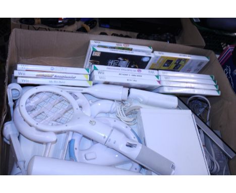 A working Wii console with accessories and assorted games 