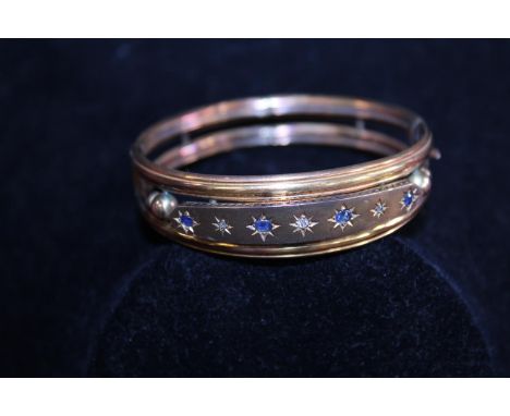 A 9ct gold bangle 13.47g 