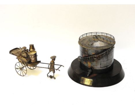A novelty Chinese white metal cruet set, together with a white metal novelty cigarette box in the form of an oil container