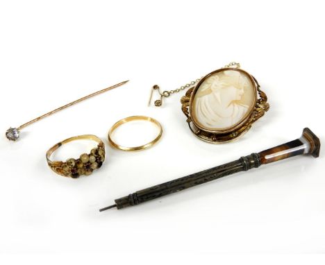 A gold mounted shell cameo, a gold single stone paste stick pin, a gold ruby and cultured pearl ring, pearls deficient and wo