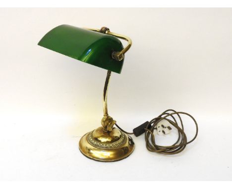 A late 19th century/early 20th century brass bankers lamp, with green glass shade, 40cm tall, together with three porcelain m