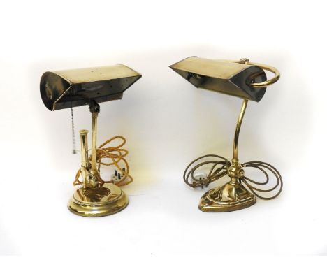 A brass art nouveau brass bankers light, together with a further similar brass lamp (2)