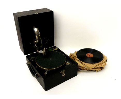 An Alba piccolo record player and records