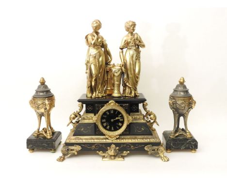 A Victorian black marble and gilt mantel clock, with two gilt spelter figures and a pair of non matching vase ornaments 53cm 