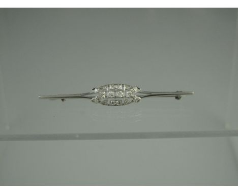 AN ART DECO DIAMOND BAR BROOCH set with old cut diamonds.  Length 60mm. CONDITION REPORT: In good condition, no obvious damag