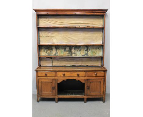 EARLY 19th CENTURY WELSH OAK DOG KENNEL DRESSER having moulded cornice over three shelf boarded rack back, the base with moul