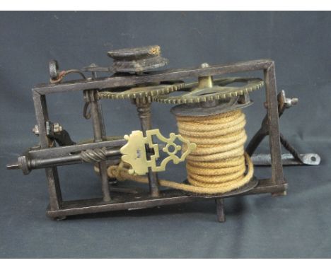18th CENTURY WROUGHT IRON AND BRASS, WEIGHT DRIVEN SPIT JACK ENGINE incorporating two wall brackets, the open frame with bras