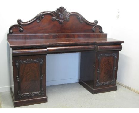 VICTORIAN MAHOGANY BREAK FRONT SIDEBOARD, having arched foliate moulded back over small shelf, the break front with three cus