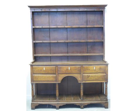 EARLY 19th CENTURY WELSH OAK POT BOARD DRESSER, having boarded three shelf rack back under a moulded cornice with iron hooks,