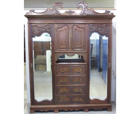 EDWARDIAN ROCCOCO STYLE MAHOGANY MIRROR DOOR WARDROBE having foliate moulded scrolled and pierced pediment over two bevelled 