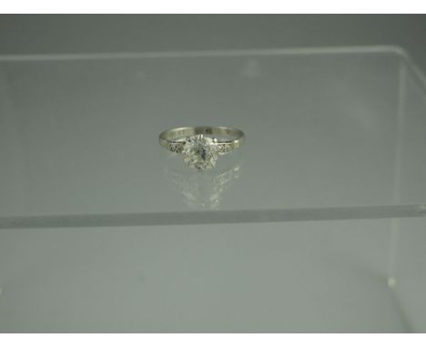 A PLATINUM AND DIAMOND SOLITAIRE RING.  The cushion cut diamond 7mm x 7mm, depth 6mm.  Estimated diamond weight 1.6cts.  Ring