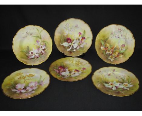 SET OF SIX ROYAL WORCESTER PORCELAIN CABINET PLATES hand-painted with floral sprays within gilt shaped edge rims.  Printed pu